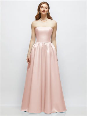 Strapless blush-pink satin gown with fitted bodice, drop waist, and full skirt