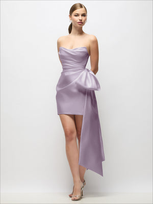 Lavender strapless satin mini dress with draped pleats and long bow tail