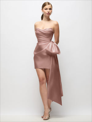 Mauve satin strapless mini dress with pleated drape detail and long tail bow