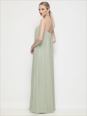 Strapless shirred chiffon maxi dress in pale green, trapeze silhouette, side view.