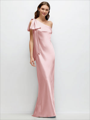 One-shoulder satin maxi dress in ballet pink with cascading shoulder bow and side slit