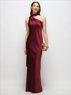 Burgundy one-shoulder draped satin maxi dress with long side tassel detail