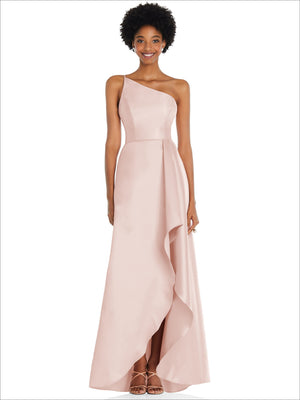 One-shoulder satin gown in pale blush pink with draped front slit and long skirt