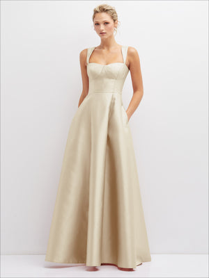 Ivory satin bustier dress with full skirt, thin straps, and side pockets