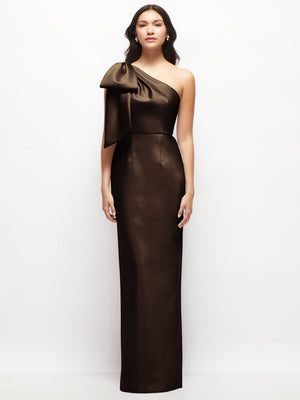 Dark satin one-shoulder column maxi dress with oversized bow at shoulder