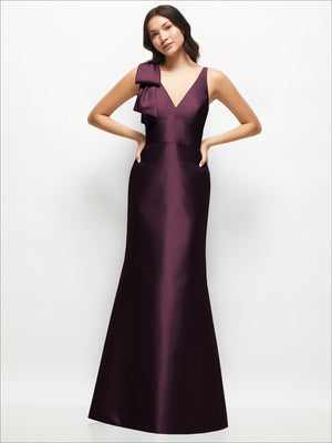 Burgundy satin trumpet dress with deep V-neck and cascading bow at one shoulder