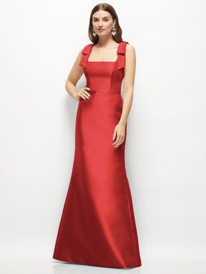 Red satin fit-and-flare maxi dress with shoulder bows and square neckline.