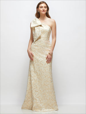 Champagne one-shoulder brocade maxi dress with bow detail and trumpet skirt