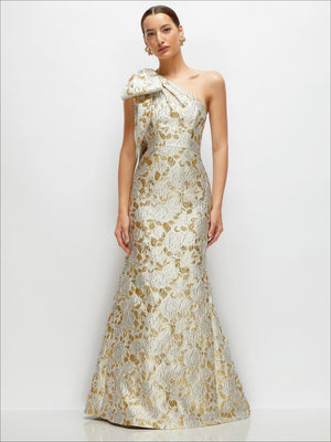 One-shoulder gold leaf brocade maxi dress with bow, trumpet hem, front view