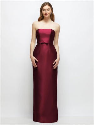 Strapless satin column dress in dark burgundy with skinny belt and bow trim at waist