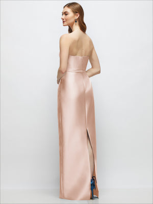 Blush strapless satin column dress with skinny belt and bow trim, side slit
