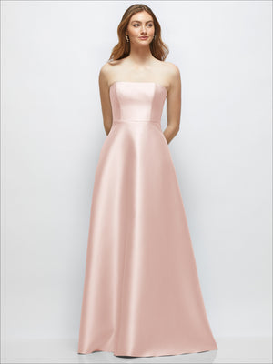 Strapless satin gown with full skirt in blush pink, fitted bodice, strapless neckline.