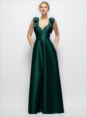 Deep green satin ball gown with deep V-neck and shoulder bow straps, full skirt