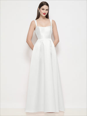 White satin maxi dress with shaped straps, squared neckline, and pleated skirt panels