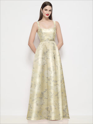 Cream satin maxi dress with gold floral print, square neckline, thin straps, pleated skirt