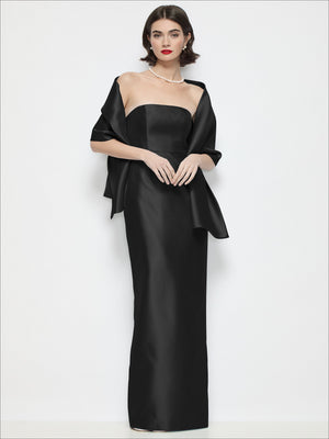 Black satin wrap stole draped over shoulders with loose ribbon ties at the sides