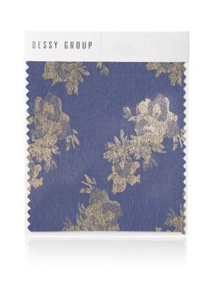 Deep blue fabric swatch with metallic gold floral foil and zigzag edges