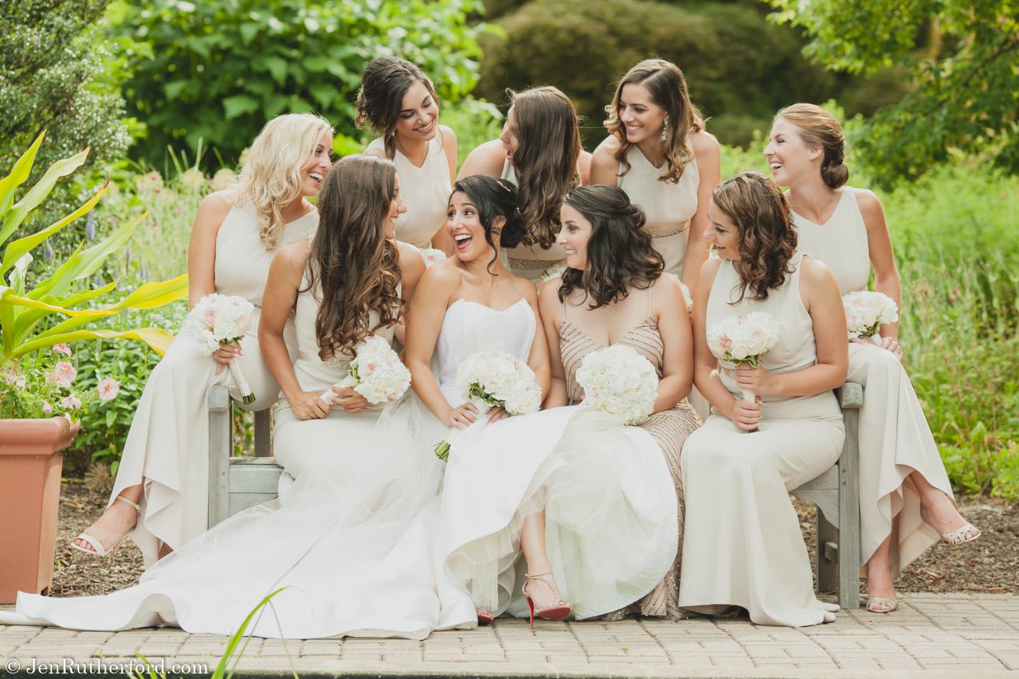 bridesmaids in white dresses with bride