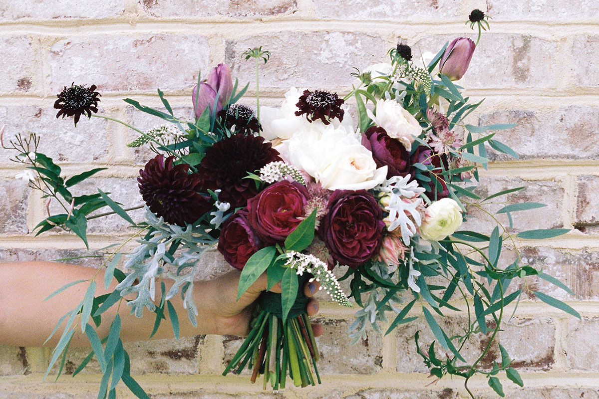 unique wedding bouquet with ivory burgundy and rose colored flowers