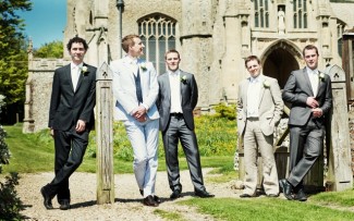 bridegroom with best men outside church 