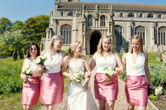 bride with bridesmaids outside church 