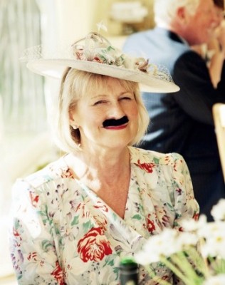 wedding guest with fake moustache 