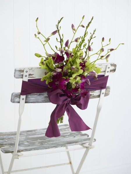 Orchid chair back wedding flower decoration