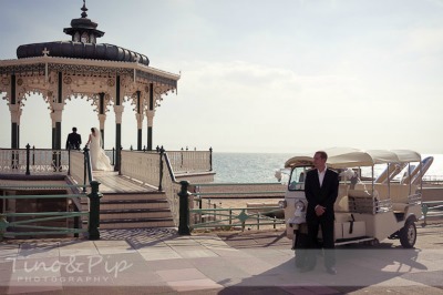 bride and groom on seaside promenade bride and groom on seaside promenade