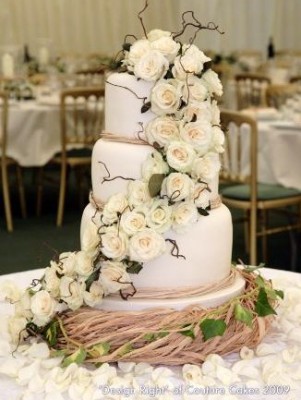 white tiered rose wedding cake