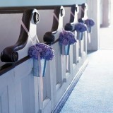 Blue hydrangeas decorating wedding pews