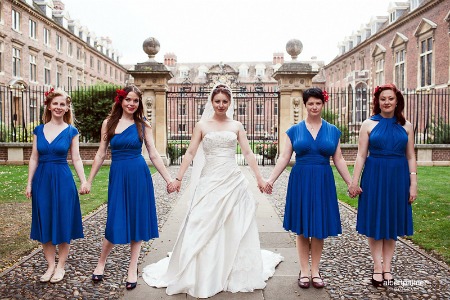 bridesmaids in blue convertible dresses at wedding