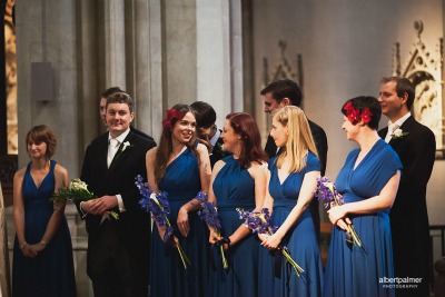 bridesmaids in blue dresses in church