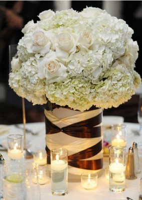 white roses and carnation table centrepiece 