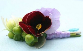 red and purple pansy buttonhole