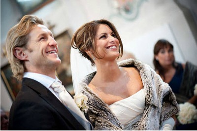 bride and groom at winter wedding with fur shrug