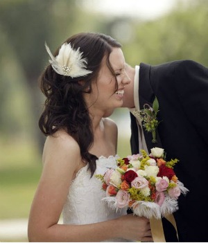 bride with feather wedding bouquet 