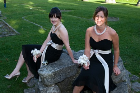 bridesmaids in elegant black strapless dresses