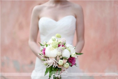 bride in strapless dress with peony