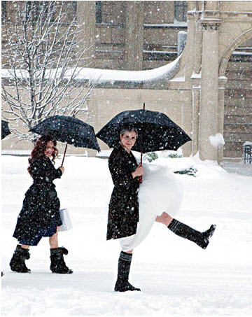 bride in wellies marching through snow 
