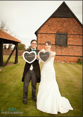 bride and groom with chalkboards