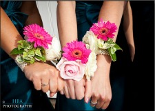 pink wrist corsages with gerberas