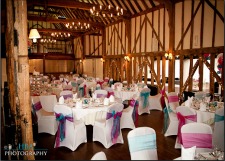 wedding tables laid out in barn
