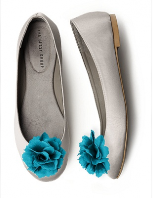White ballet flats with blue rosettes
