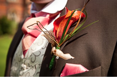 grooms buttonhole with red orchid