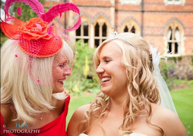 mother of bride wearing pink fascinator