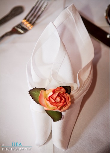 napkin with rosebud folded inside