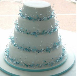 white wedding cake with blue decoration