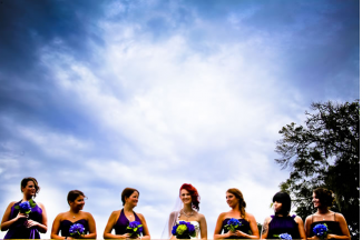 bride and bridesmaids in purple dresses 