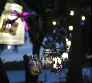 candle lanterns with purple ribbons 