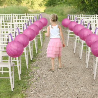 pink lanterns decorating wedding aisle